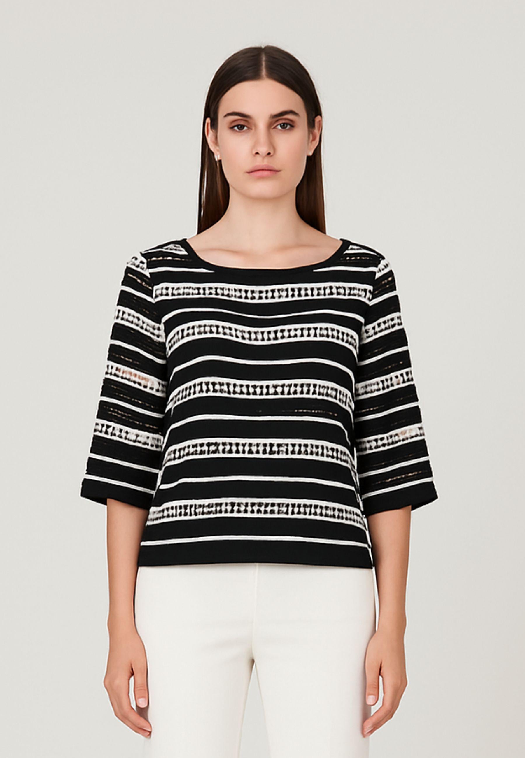 Blusa traforata con top
