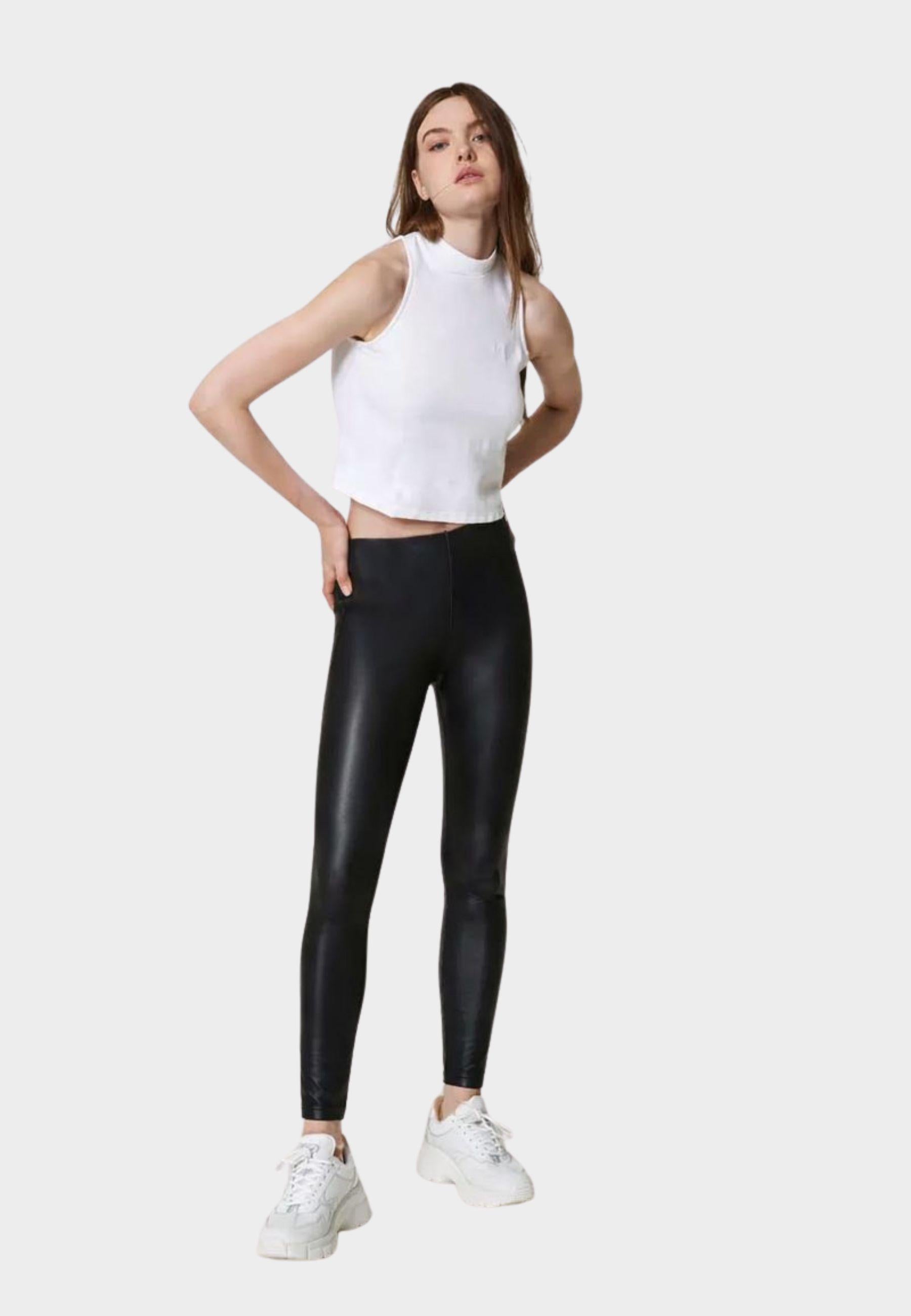 Top smanicato con collo alto in cotone interlock