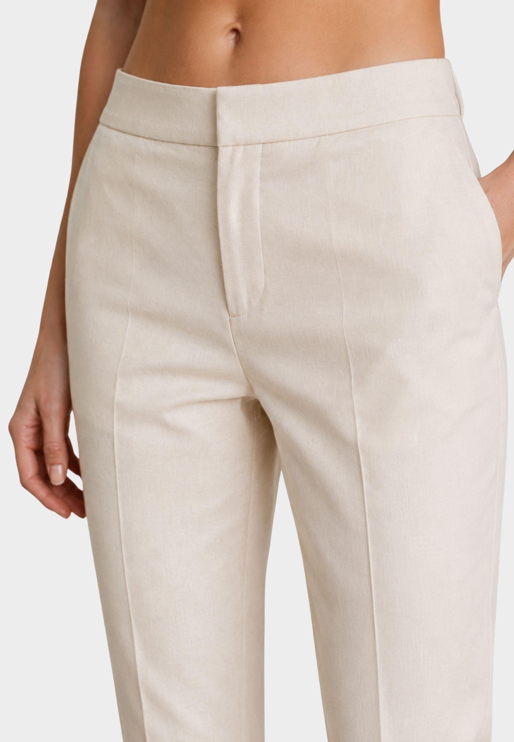 Pantaloni a sigaretta con piega
