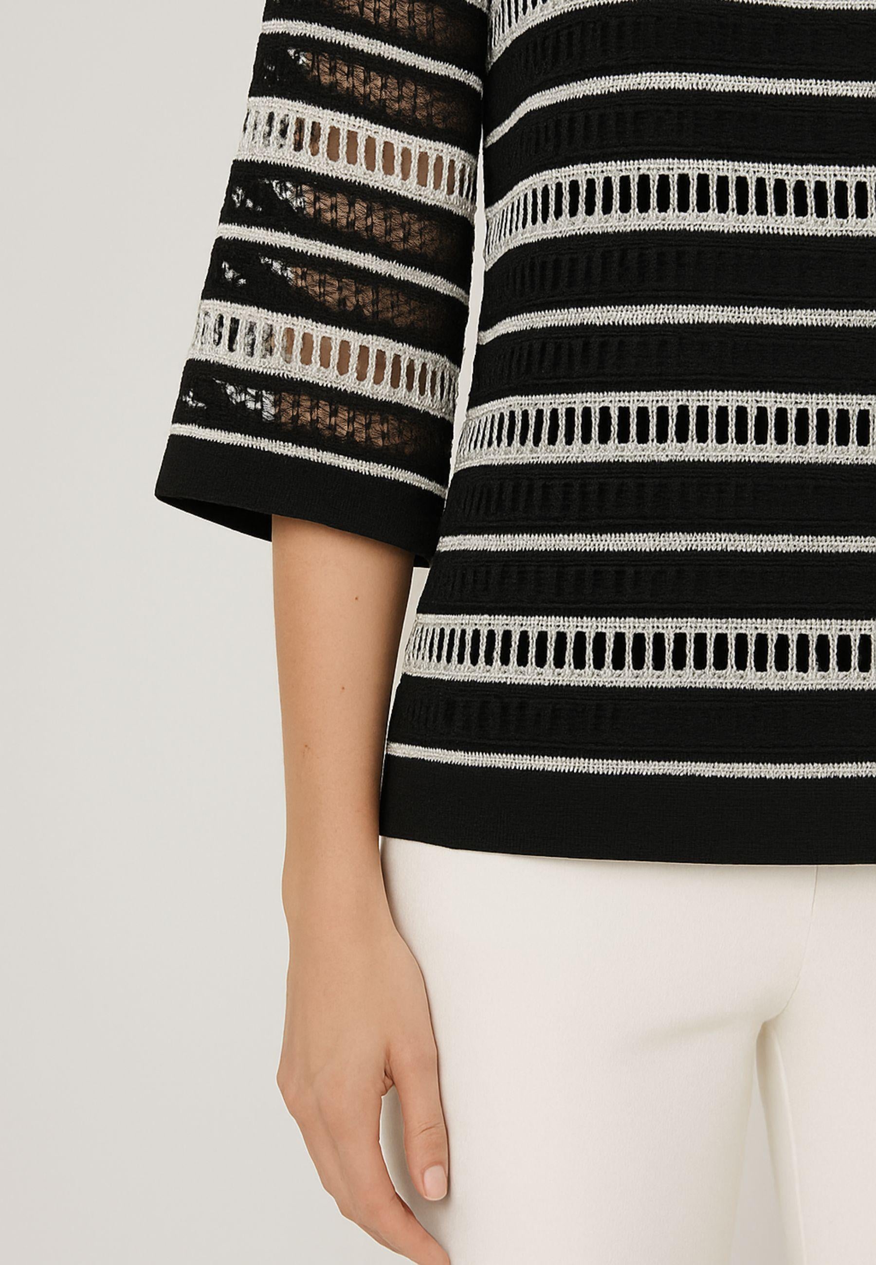 Blusa traforata con top