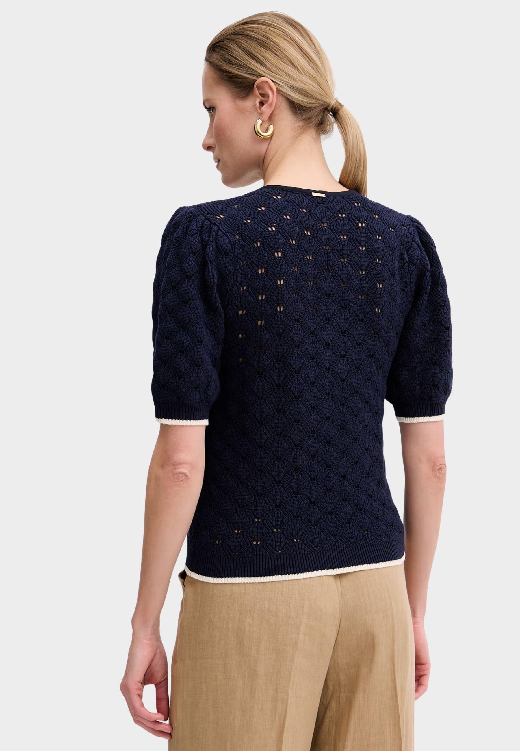 Maglia Twinset traforata con fiocco al collo