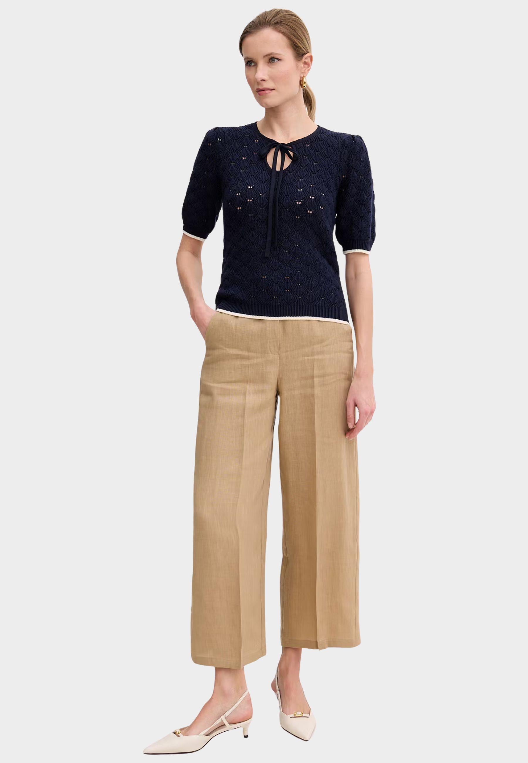 Maglia Twinset traforata con fiocco al collo