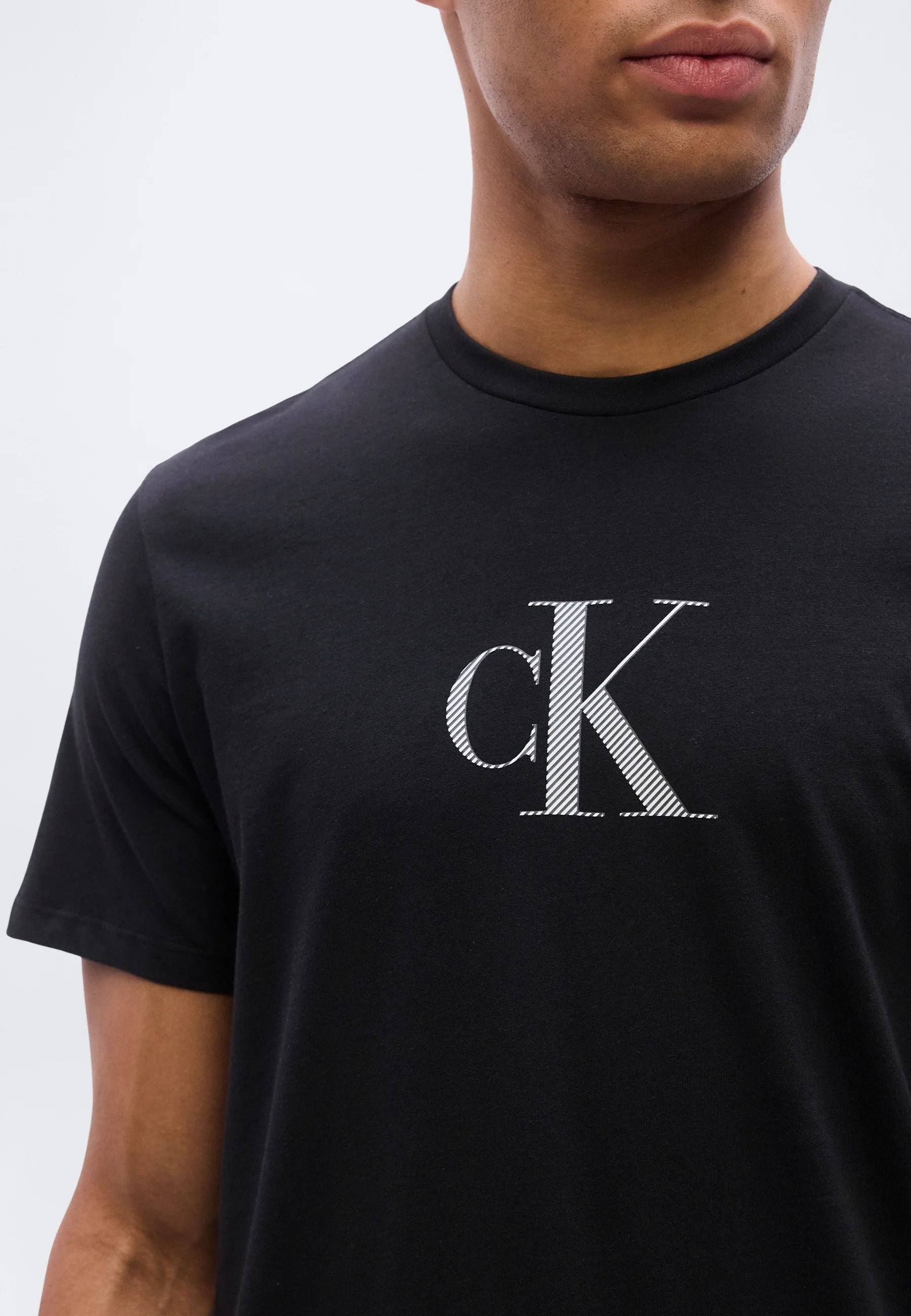 Calvin Klein - T-shirt logo CK in jersey di cotone 