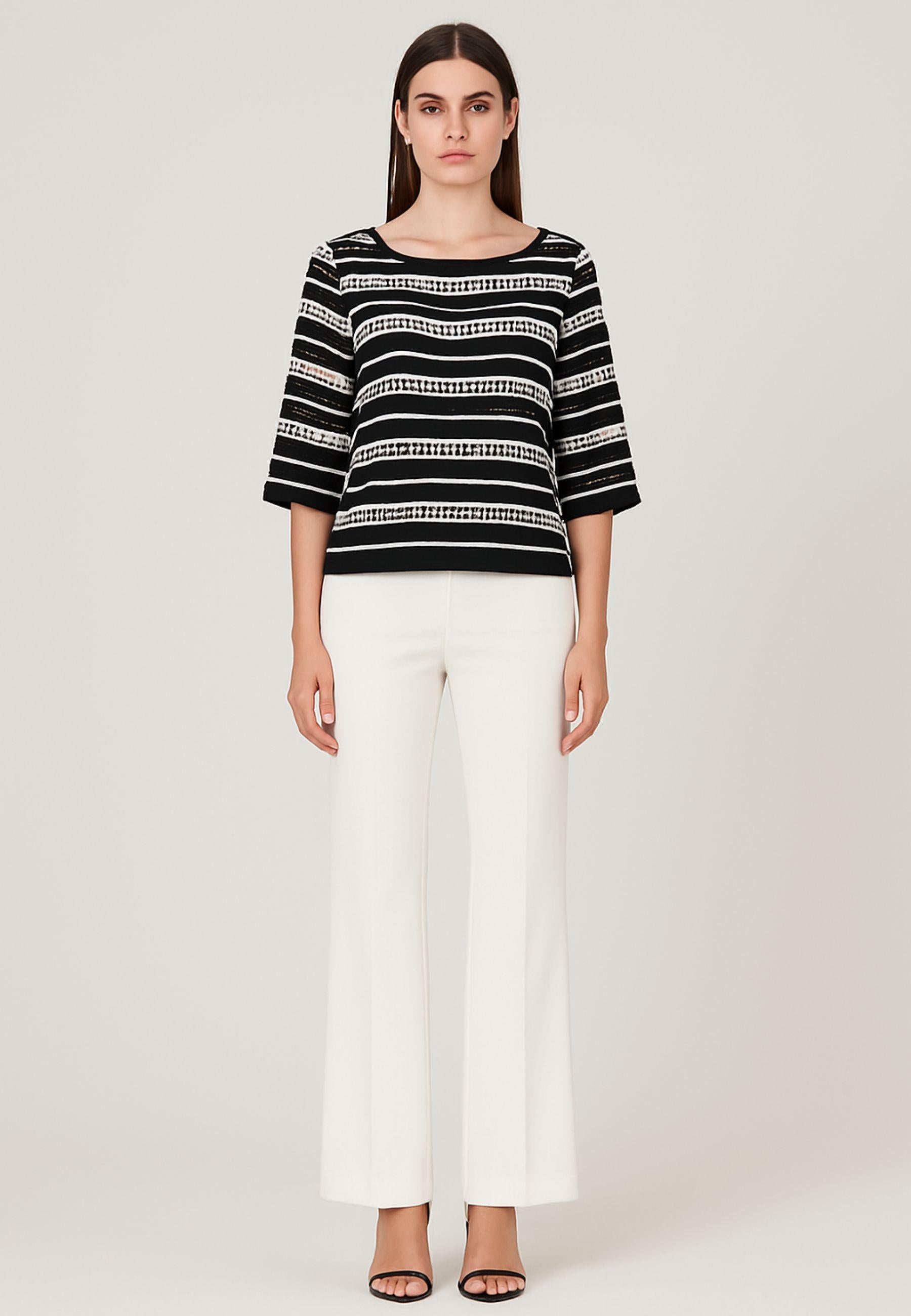 Blusa traforata con top 